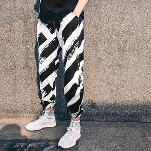 "ZEBRA" MESOL STRIPED PANTS